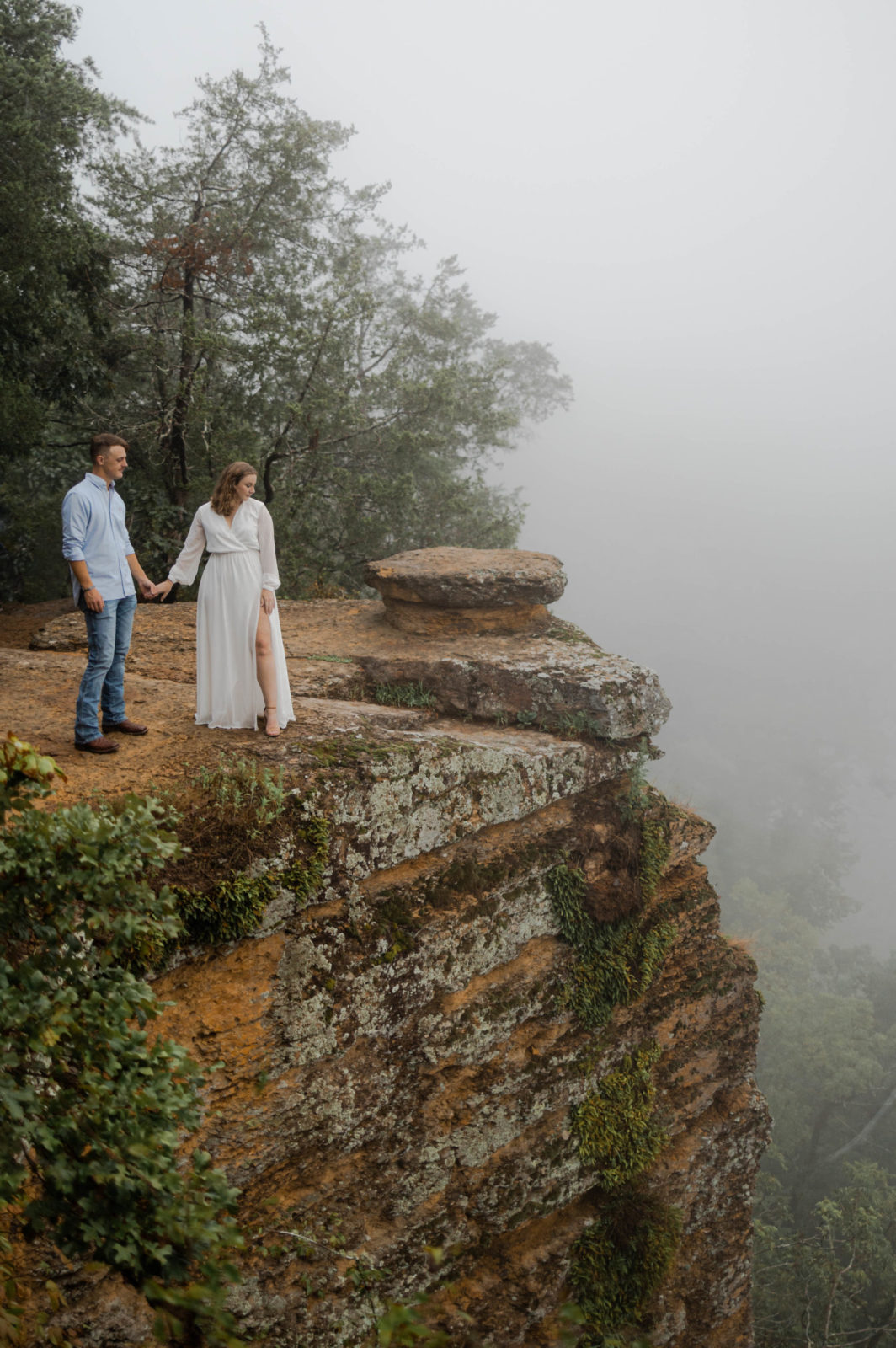 Bride and groom overlook the cliff at Harpeth River.