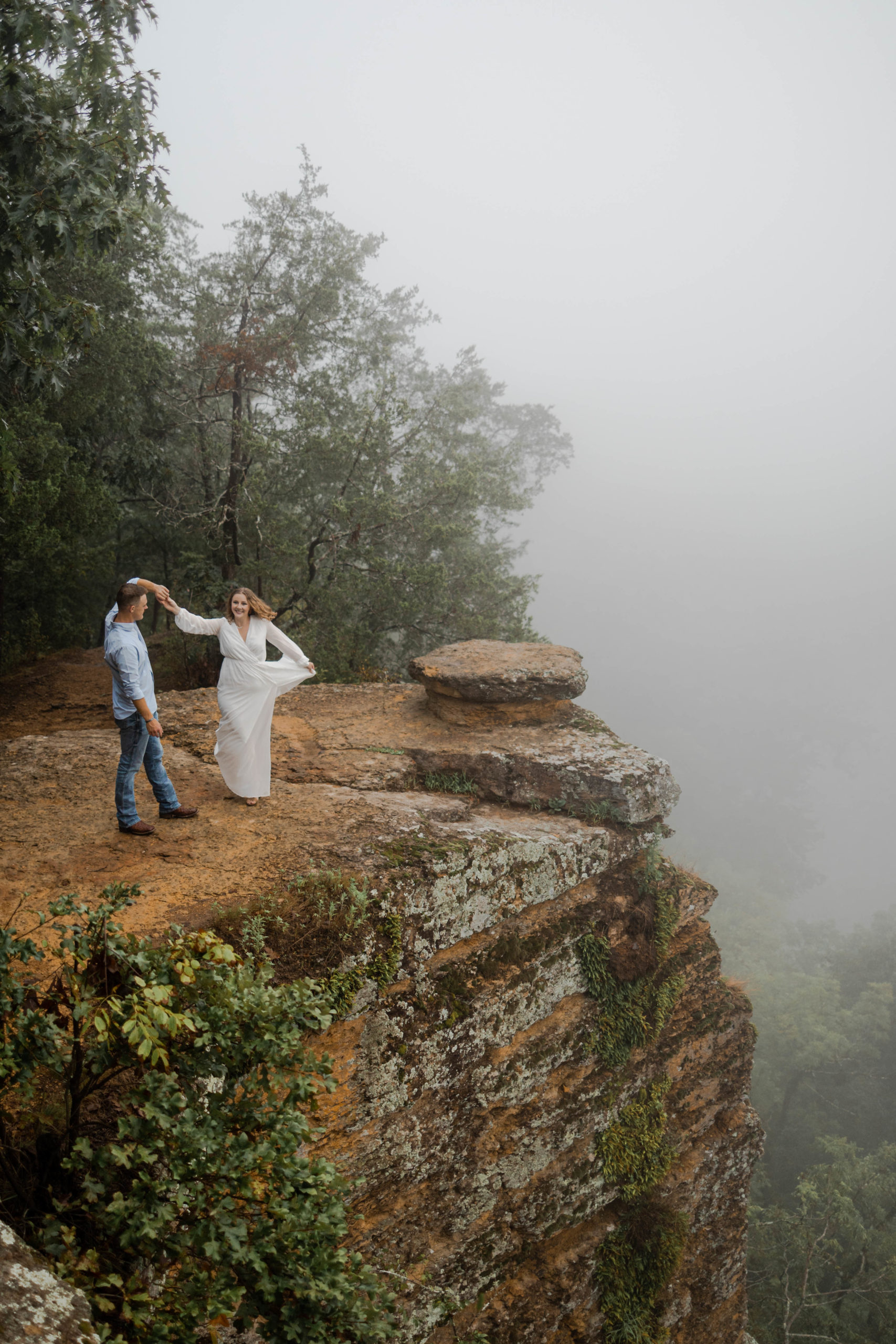 Bride and groom on the cliff at Harpeth River outside of Nashville.