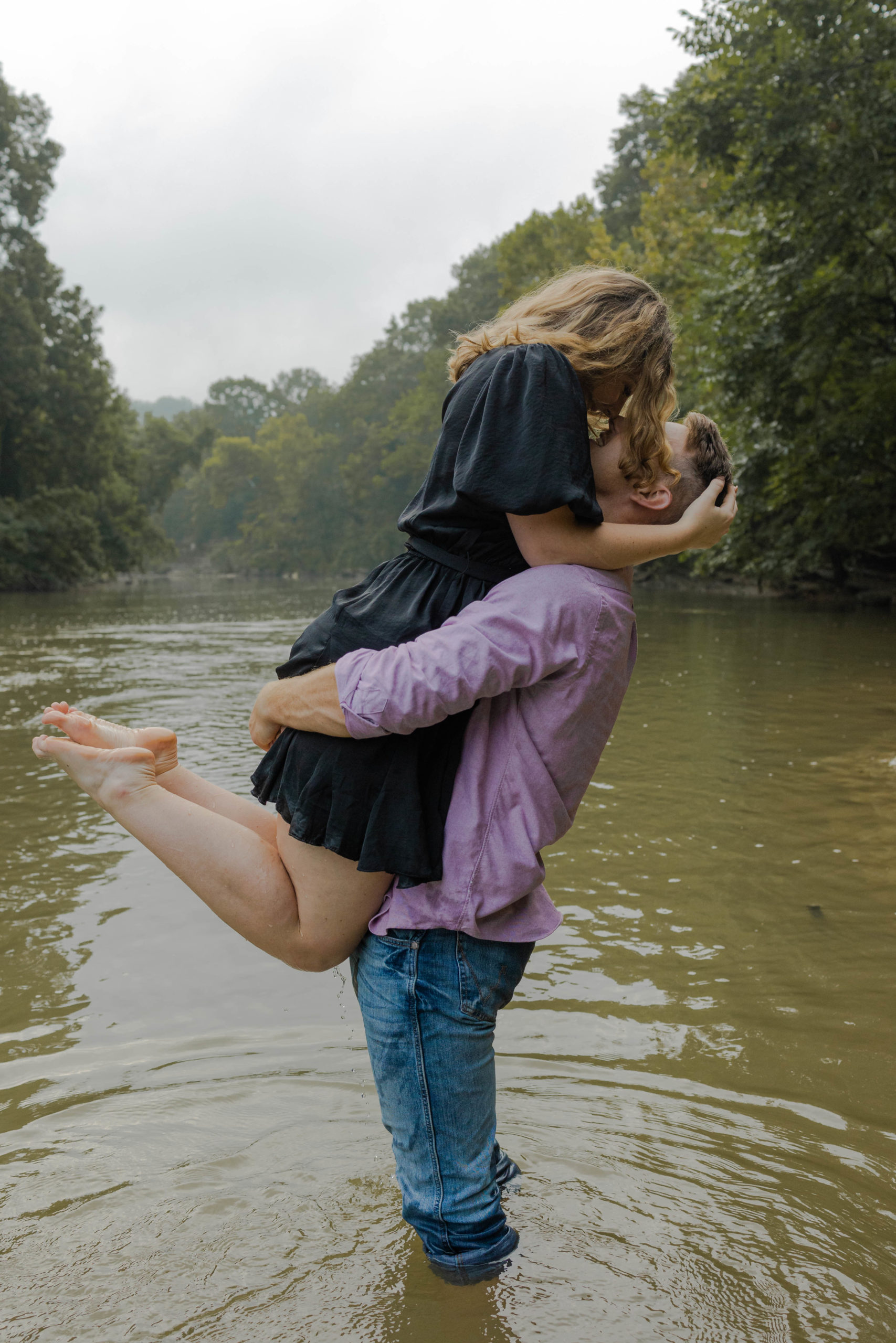 A couple being photographed in the Harpeth River.