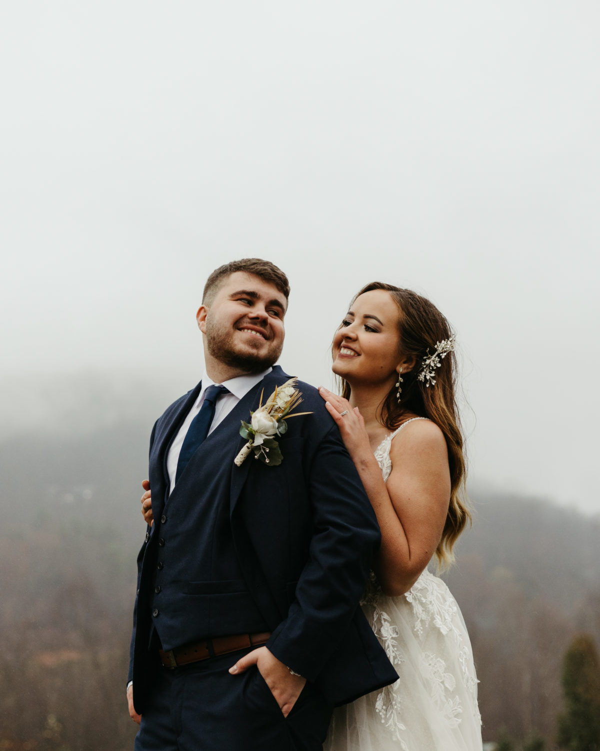 A bride and groom smiling during their smoky mountain elopement
