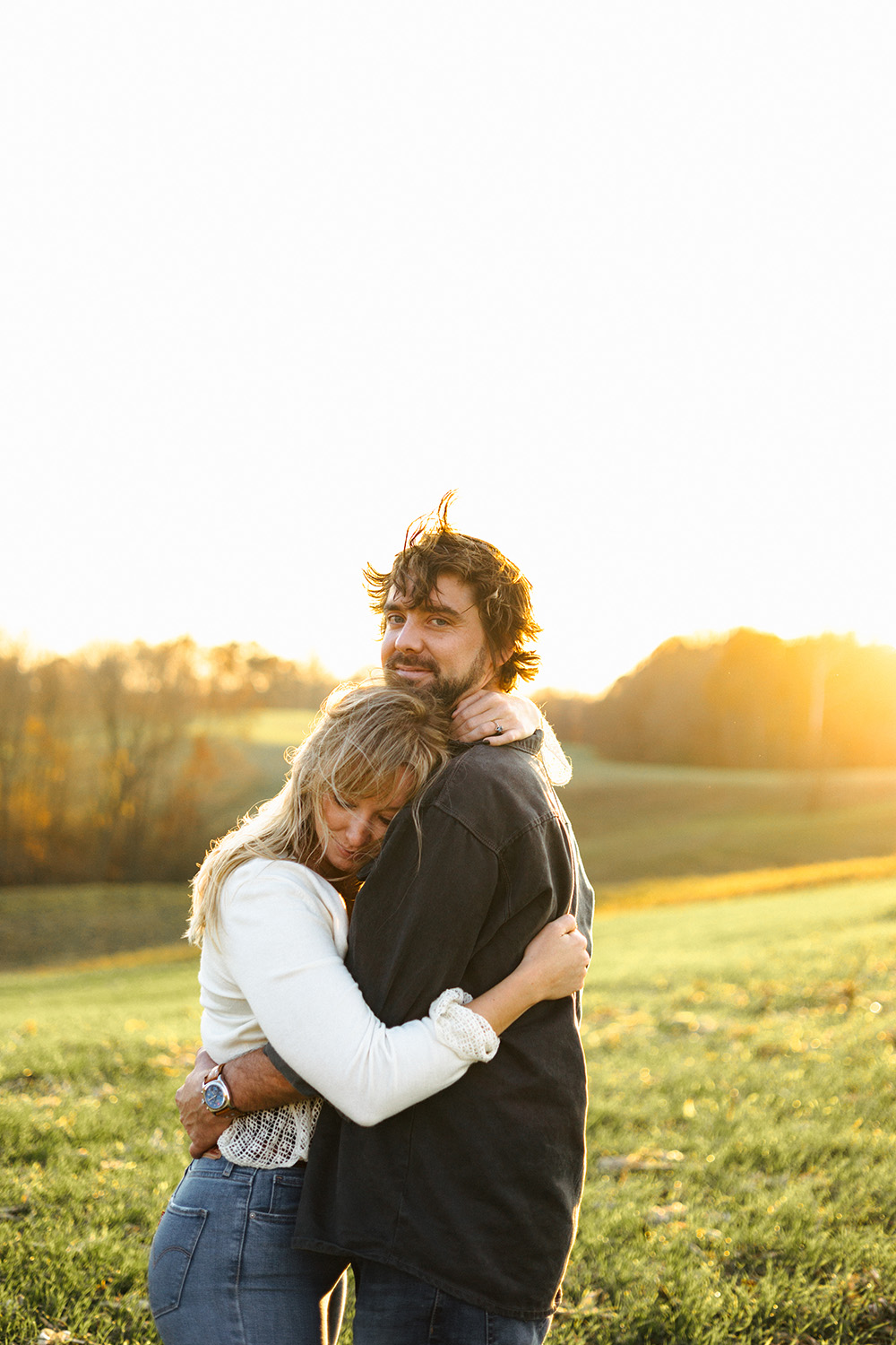 A couple hugs for a boho engagement photo in Nashville, Tennessee.
