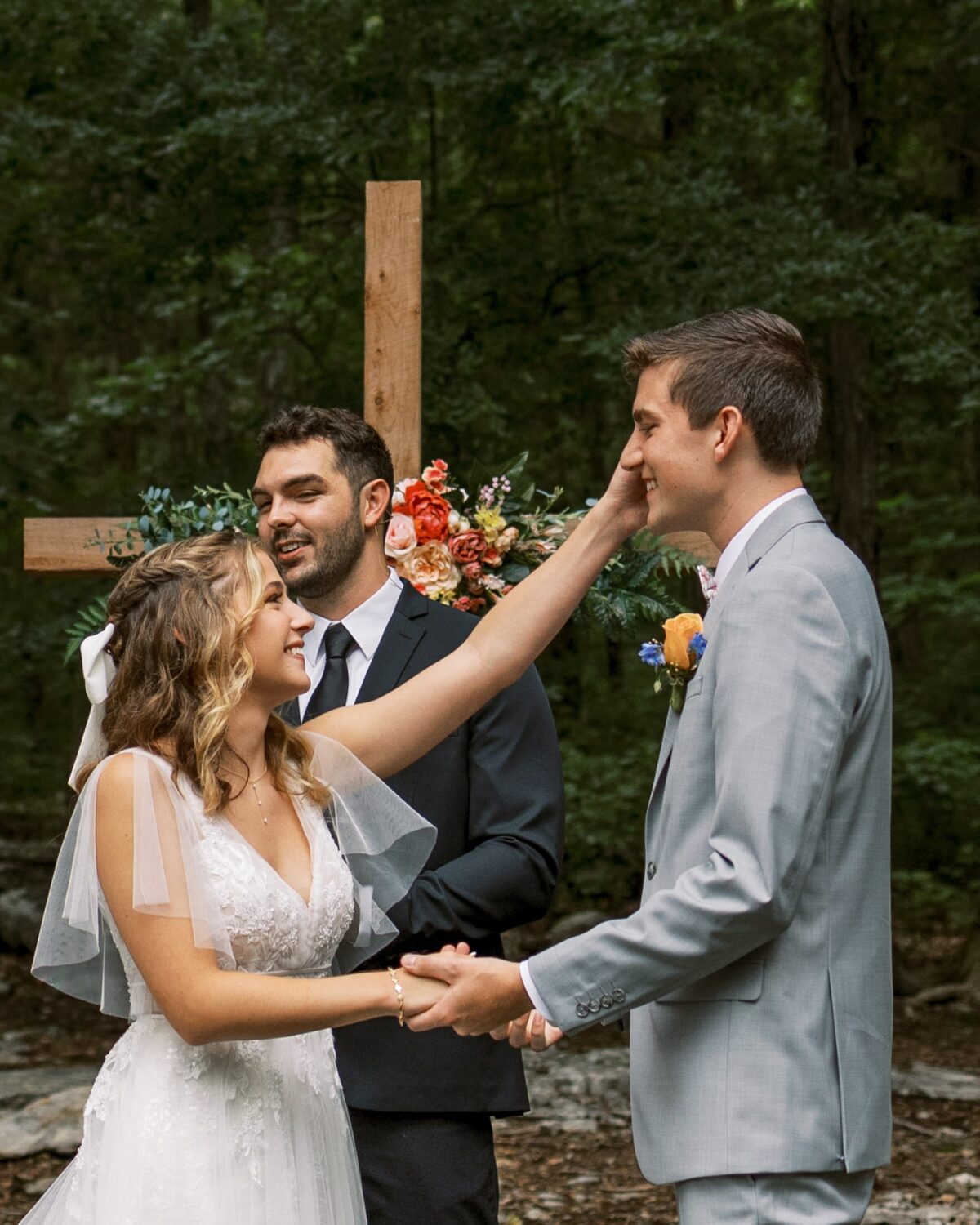 A couple smiles at Saddle Wood Farms in Tennessee while saying their vows.