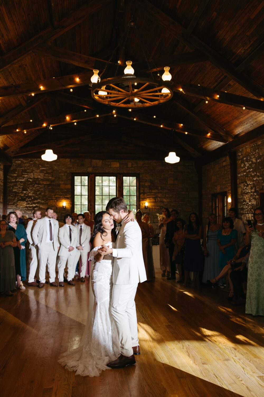 A wedding couple has a first dance inside Assembly Hall.