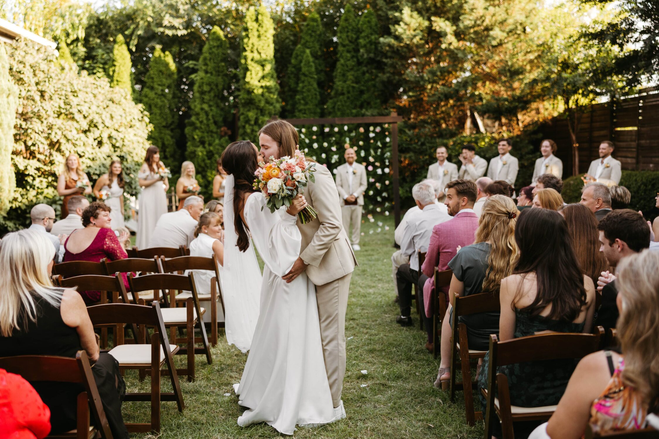 A bride and groom kiss after their ceremony in the courtyard at the Cordelle in Nashville, Tennessee.