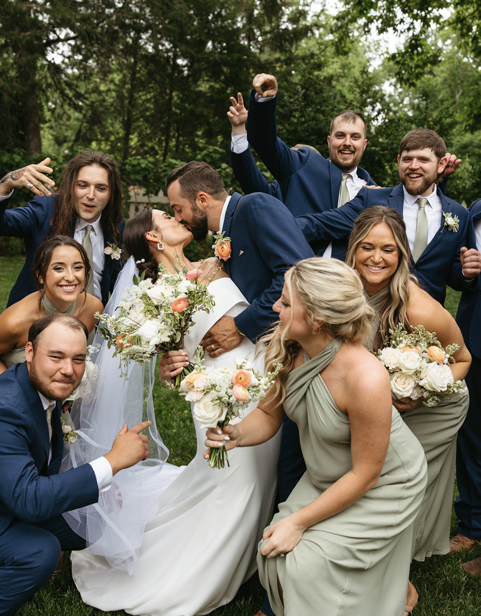 A bridal party cheers with the bride and groom at Belle Meade Winery.