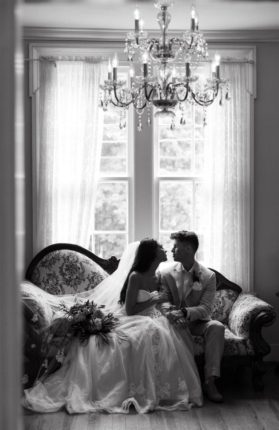 A couple looks at one another on their wedding day at Drakewood Farm.